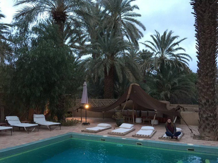 The pool area during day time at Dar Qamar in Agdez, Morocco
